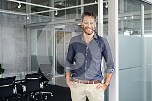 Successful business man looking at camera in office