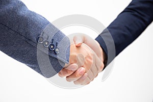 Successful business men shake hands isolated on white background