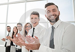 Successful business people applaud standing