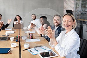 Successful Business People Applauding Celebrating Success In Modern Office