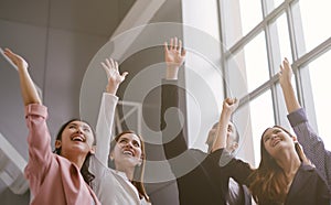 Successful of Business People Celebrating In office. Group of Happy business team hands raised for success and winning. photo