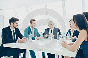Successful business people during a meeting sitting around table