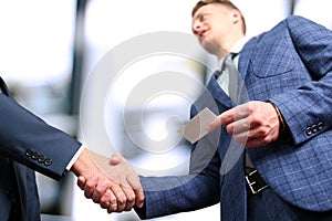 Successful business people shaking hands at the meeting