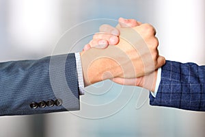 Successful business people shaking hands at the meeting