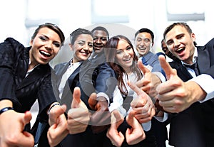 Successful business people with thumbs