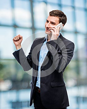 Successful business on the phone, businessman in a suit talking