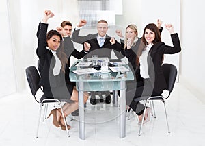 Successful Business Team With Arms Raised