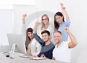 Successful Business Team With Arms Raised