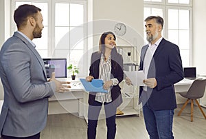 Successful business team communicating during staff meeting in office