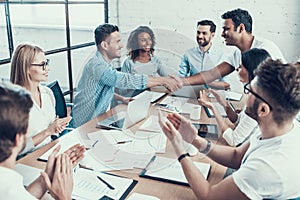 Successful Business Team Congratulating Colleague