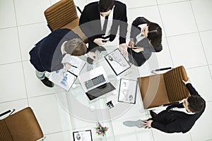 successful business team discussing marketing graphics at a working meeting