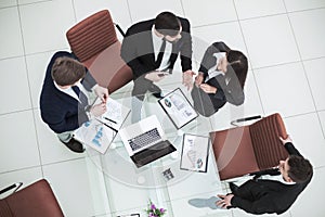 successful business team discussing marketing graphics at a working meeting