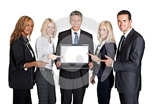 Successful business team displaying a laptop