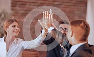 Successful business team giving each other a high five