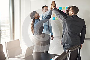 Successful business team giving a high fives