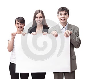 Successful business team holding a blank banner.