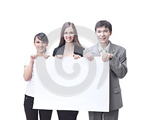 Successful business team holding a blank banner.