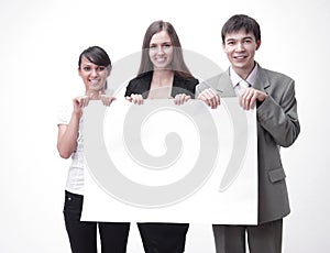 Successful business team holding a blank banner.