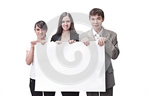 Successful business team holding a blank banner. photo with copy space