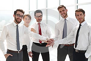 Successful business team holding hands