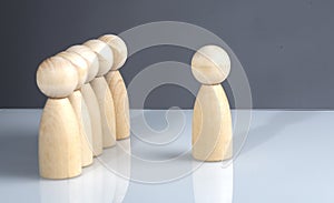 Successful business team leader concept: Wooden figures standing out from the crowd