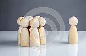 Successful business team leader concept: Wooden figures standing out from the crowd