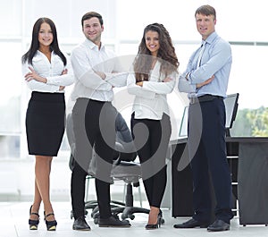 Successful business team standing near the desktop