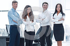 Successful business team standing near the desktop