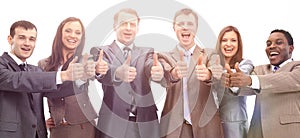 Successful business team with thumbs up