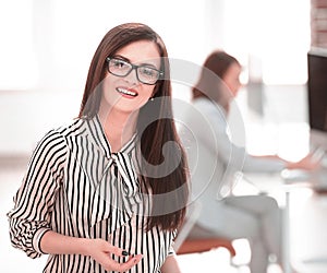 Successful business woman on the background of her office