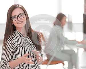 Successful business woman on the background of her office