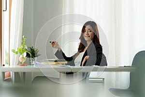 Successful business woman excited when her business growth and good news. Finance concept.