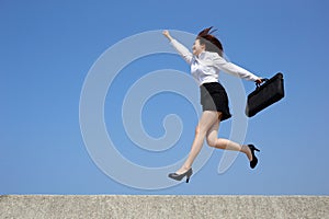 Successful business woman jump
