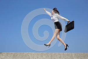 Successful business woman jump