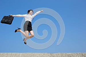 Successful business woman jump