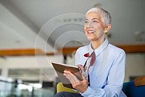 Successful business woman looking confident and smiling