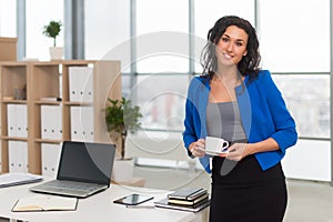 Successful business woman looking confident and smiling.