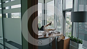 Successful business woman sitting office desk talking phone. Lady taking break.