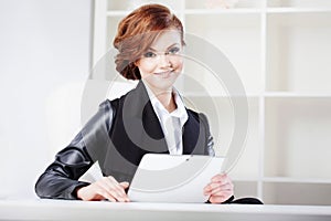 Successful business woman with tablet in hand