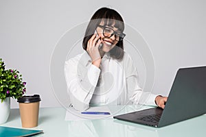 Successful business woman talking on the smart phone at meeting room