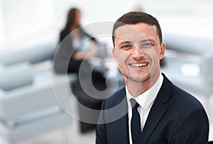 Successful businessman on blurred background office