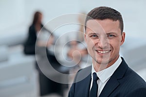 Successful businessman on blurred background office
