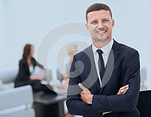 Successful businessman on blurred background office