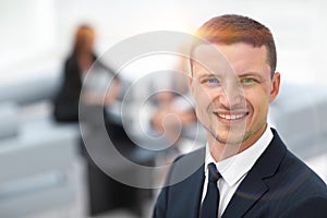 Successful businessman on blurred background office