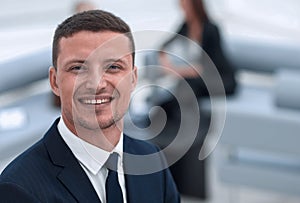 Successful businessman on blurred background office