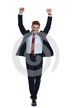 Successful businessman celebrating with his fists in the air