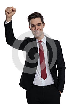 Successful businessman celebrating with his fists in the air