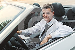 Successful businessman driving his car