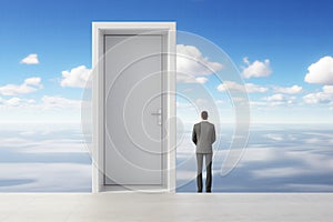 Successful businessman entering surreal doorway to freedom. Bright light, clouds, and white walls