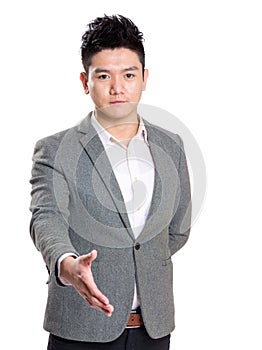 Successful businessman giving hand